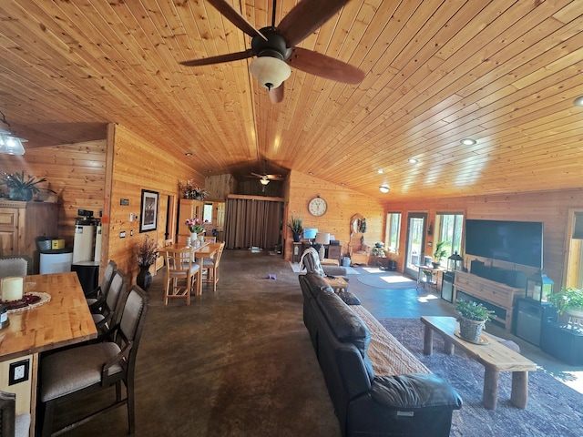 49818 Long Lake Trl, Bigfork, MN 56628 - living area featuring wooden walls, a ceiling fan, lofted ceiling, wood ceiling, and finished concrete floors