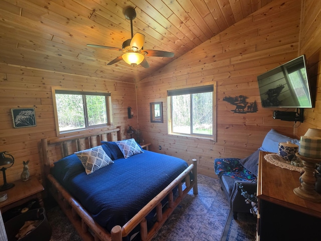 49818 Long Lake Trl, Bigfork, MN 56628 - bedroom with multiple windows, vaulted ceiling, wooden walls, ceiling fan, and wooden ceiling