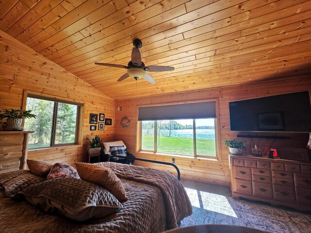 49818 Long Lake Trl, Bigfork, MN 56628 - bedroom featuring lofted ceiling, wooden walls, wood ceiling, a ceiling fan, and carpet