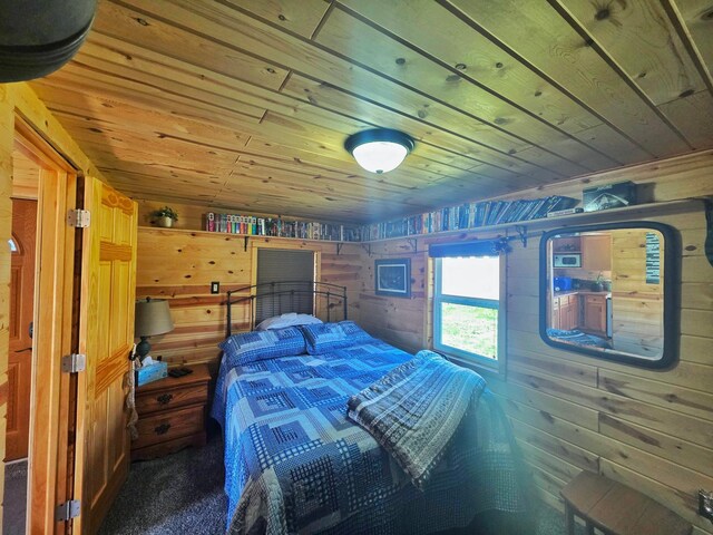 49818 Long Lake Trl, Bigfork, MN 56628 - bedroom featuring wooden ceiling, wooden walls, and carpet