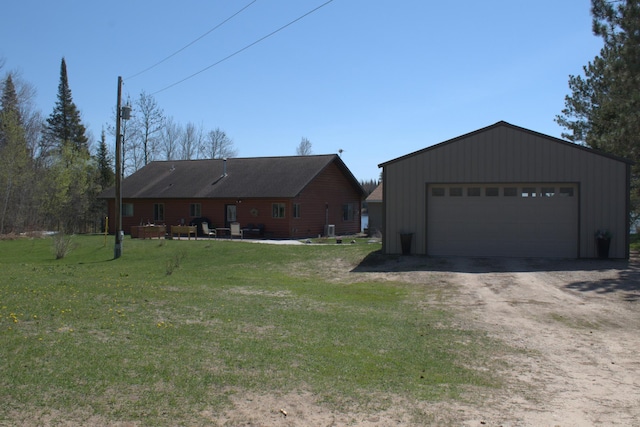 49818 Long Lake Trl, Bigfork, MN 56628 - view of front of property with a garage, a front yard, and an outbuilding