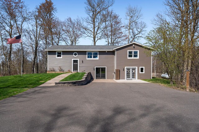 695 Pine Lake Ln, Bone Lake Twp, WI 54837 - back of house featuring a yard and french doors