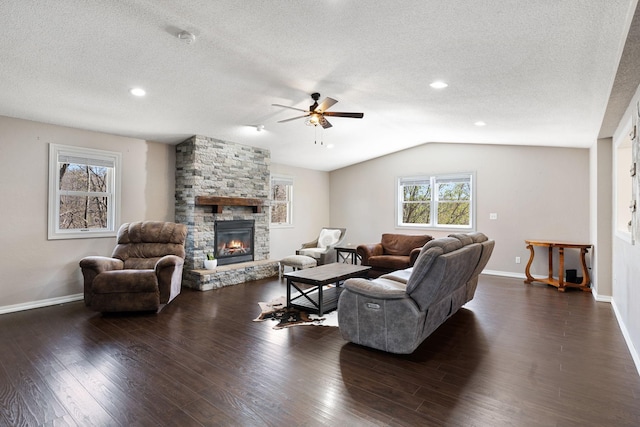 695 Pine Lake Ln, Bone Lake Twp, WI 54837 - living room with a ceiling fan, baseboards, a fireplace, and a textured ceiling