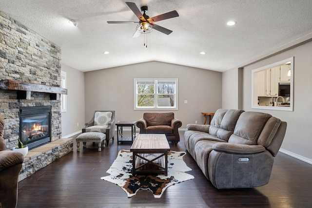 695 Pine Lake Ln, Bone Lake Twp, WI 54837 - living area featuring a textured ceiling, vaulted ceiling, wood-type flooring, and ceiling fan