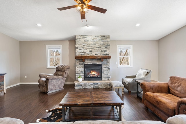 695 Pine Lake Ln, Bone Lake Twp, WI 54837 - living room with baseboards, a fireplace, a ceiling fan, and a healthy amount of sunlight