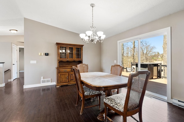 695 Pine Lake Ln, Bone Lake Twp, WI 54837 - dining room featuring lofted ceiling, baseboards, dark wood-style flooring, an inviting chandelier, and visible vents