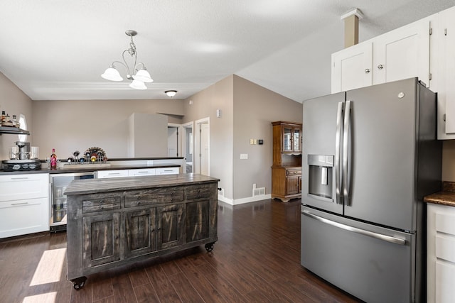 695 Pine Lake Ln, Bone Lake Twp, WI 54837 - kitchen with dark wood-type flooring, beverage cooler, white cabinets, stainless steel fridge with ice dispenser, and dark countertops