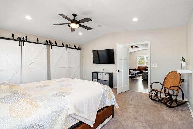 695 Pine Lake Ln, Bone Lake Twp, WI 54837 - bedroom with light colored carpet, lofted ceiling, a barn door, and recessed lighting