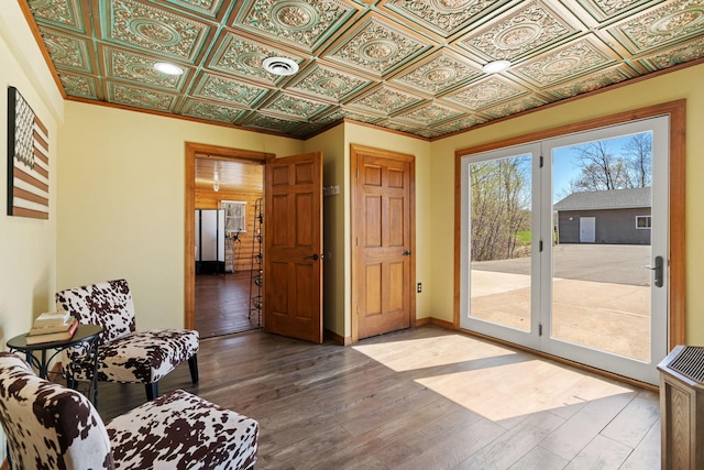 695 Pine Lake Ln, Bone Lake Twp, WI 54837 - doorway featuring baseboards, hardwood / wood-style floors, and an ornate ceiling