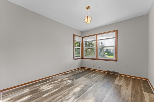7544 4th Ave S, Richfield, MN 55423 - unfurnished room featuring wood finished floors and baseboards