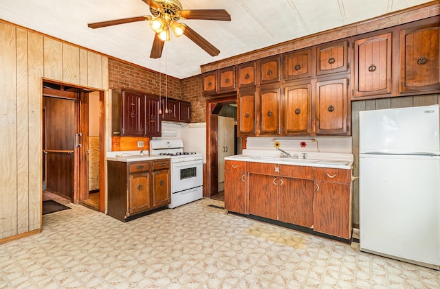 316 Main St, Belle Plaine, MN 56011 - kitchen featuring white appliances, light floors, light countertops, and a ceiling fan