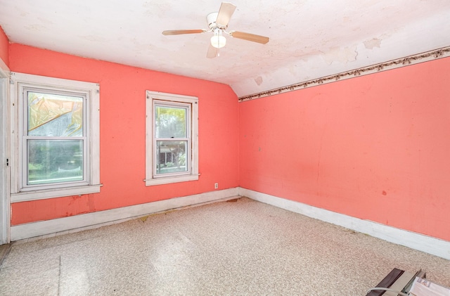 316 Main St, Belle Plaine, MN 56011 - spare room featuring vaulted ceiling and a ceiling fan