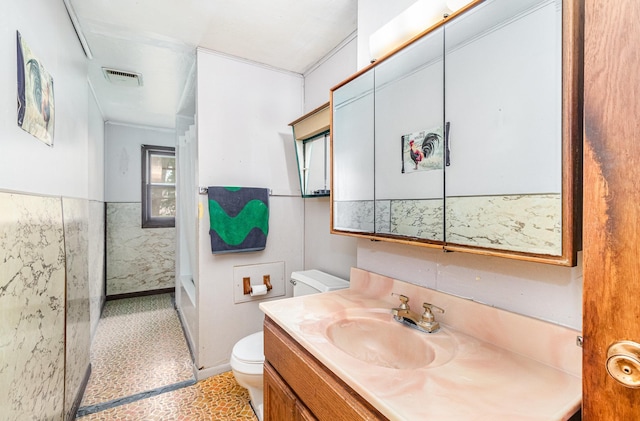 316 Main St, Belle Plaine, MN 56011 - bathroom featuring vanity and wainscoting