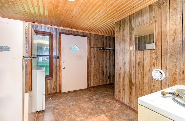 316 Main St, Belle Plaine, MN 56011 - entryway with wood walls, wood ceiling, and washer / clothes dryer