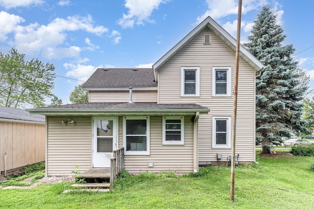 316 Main St, Belle Plaine, MN 56011 - rear view of house with a yard and roof with shingles
