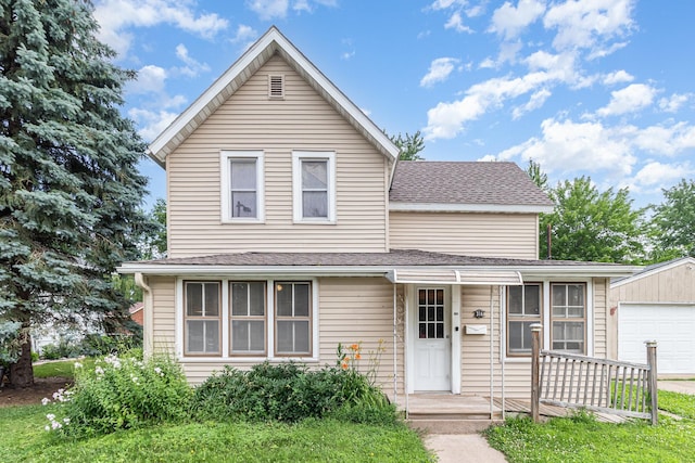 316 Main St, Belle Plaine, MN 56011 - traditional-style house with a garage, an outbuilding, and a shingled roof