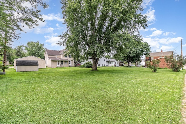 316 Main St, Belle Plaine, MN 56011 - view of green lawn featuring an outdoor structure