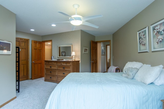 bedroom featuring recessed lighting, a ceiling fan, and light carpet