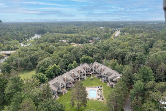drone / aerial view featuring a view of trees