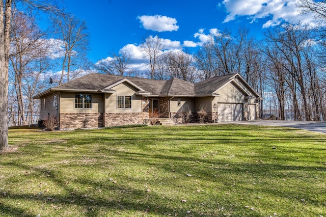 22410 Williams Rd SE, Ten Lake Twp, MN 56633 - ranch-style home with brick siding, a front lawn, an attached garage, and aphalt driveway
