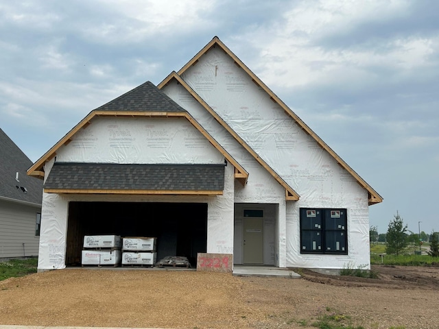 2229 Sharon Ln, Hudson, WI 54016 - property under construction with a shingled roof, an attached garage, and driveway