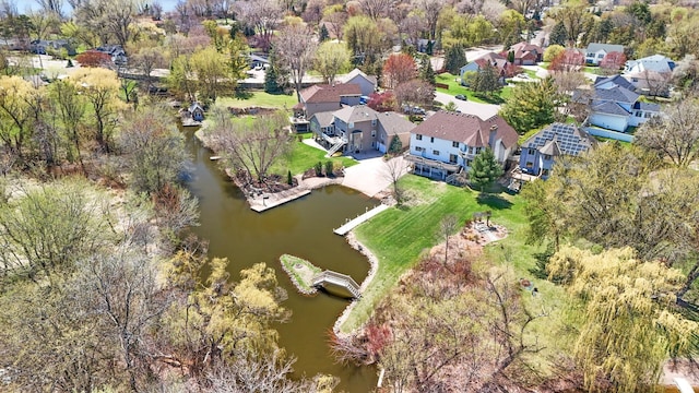 1427 Rosewood Ct, New Brighton, MN 55112 - aerial view of property and surrounding area featuring a large body of water, a tree filled landscape, and nearby suburban area