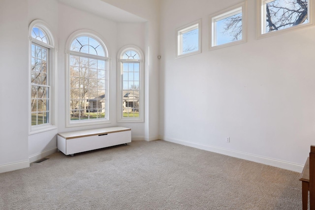 empty room with carpet flooring and baseboards