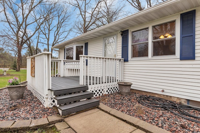 property entrance featuring a wooden deck