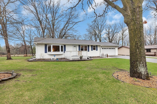 single story home featuring concrete driveway, a front yard, and a garage