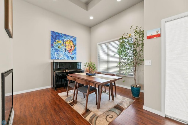 dining room with wood finished floors, baseboards, and recessed lighting