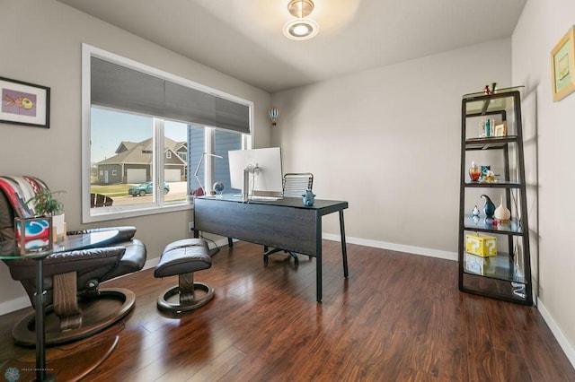office space featuring baseboards and dark wood-type flooring