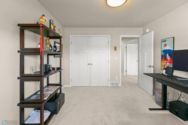 interior space featuring baseboards, carpet flooring, and visible vents