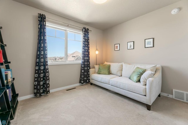 interior space with baseboards, visible vents, and carpet floors