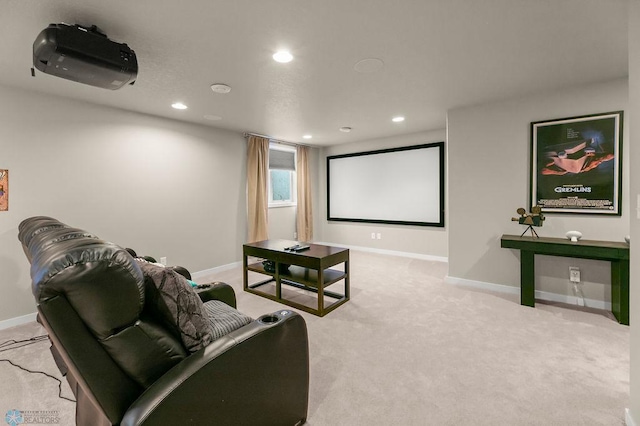 home theater room featuring baseboards, light carpet, and recessed lighting