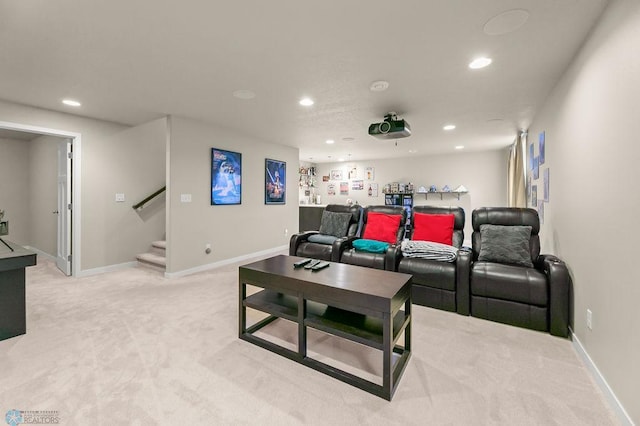 living area featuring baseboards, stairs, light carpet, and recessed lighting