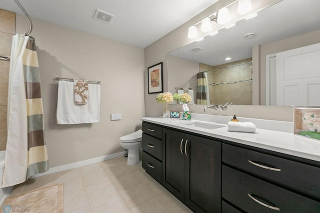 full bathroom with toilet, vanity, visible vents, tiled shower / bath, and baseboards