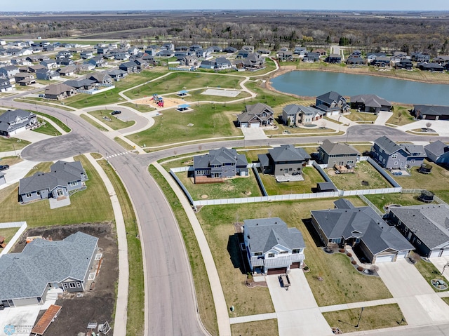 bird's eye view featuring a water view and a residential view