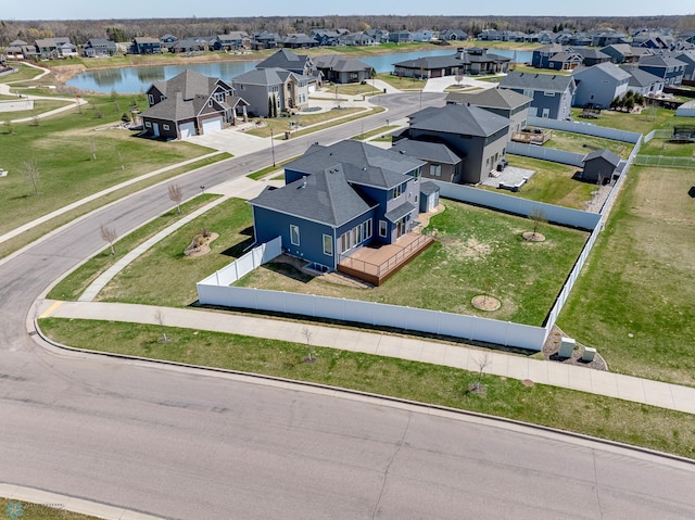 bird's eye view featuring a water view and a residential view