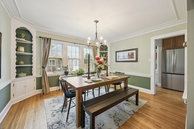 4904 11th Ave S, Minneapolis, MN 55417 - dining area with a chandelier, light wood-type flooring, and ornamental molding