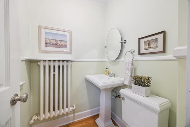 4904 11th Ave S, Minneapolis, MN 55417 - half bathroom with radiator, ornamental molding, and wood finished floors