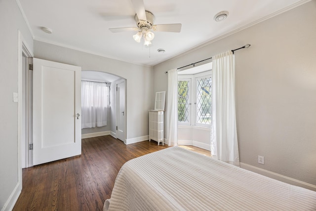4904 11th Ave S, Minneapolis, MN 55417 - bedroom featuring arched walkways, multiple windows, wood finished floors, crown molding, and a ceiling fan