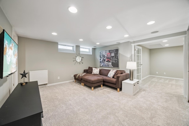 4904 11th Ave S, Minneapolis, MN 55417 - living room featuring radiator heating unit, light colored carpet, and recessed lighting