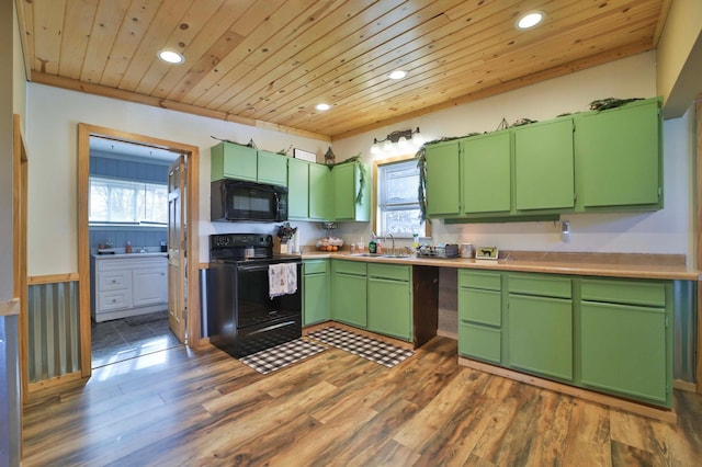 kitchen featuring recessed lighting, black appliances, and a healthy amount of sunlight