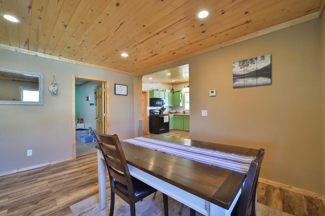 dining area with dark wood-type flooring, recessed lighting, baseboards, and wooden ceiling