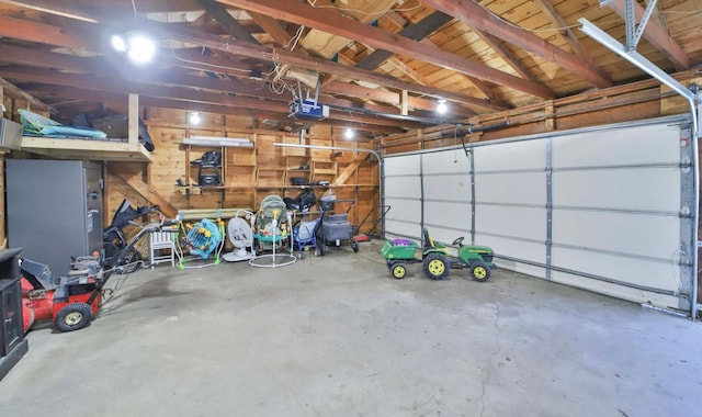 garage featuring a garage door opener