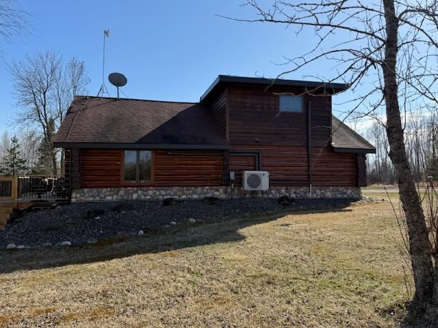 view of side of home with a lawn, a shingled roof, and ac unit