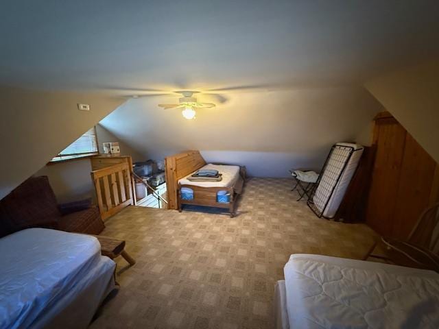 additional living space with carpet, ceiling fan, and lofted ceiling