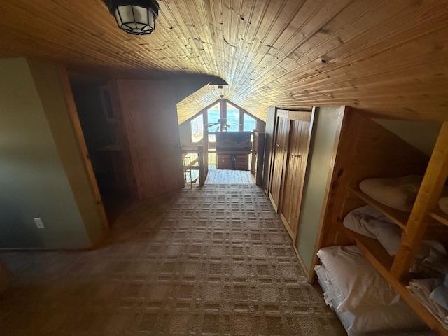 additional living space featuring wood ceiling and lofted ceiling
