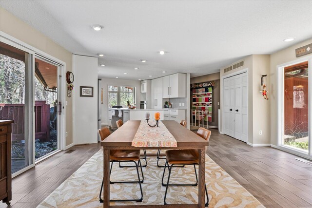 1206 Pinecrest Ln, New Richmond, WI 54017 - dining space with light wood-style flooring, baseboards, and recessed lighting
