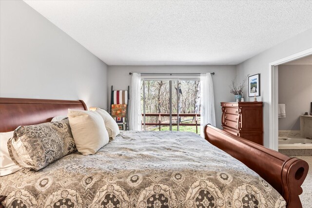 1206 Pinecrest Ln, New Richmond, WI 54017 - bedroom with access to outside, a textured ceiling, and ensuite bathroom